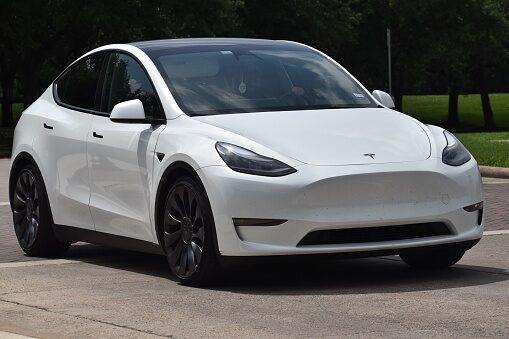 A Tesla Model Y, plugged in at home